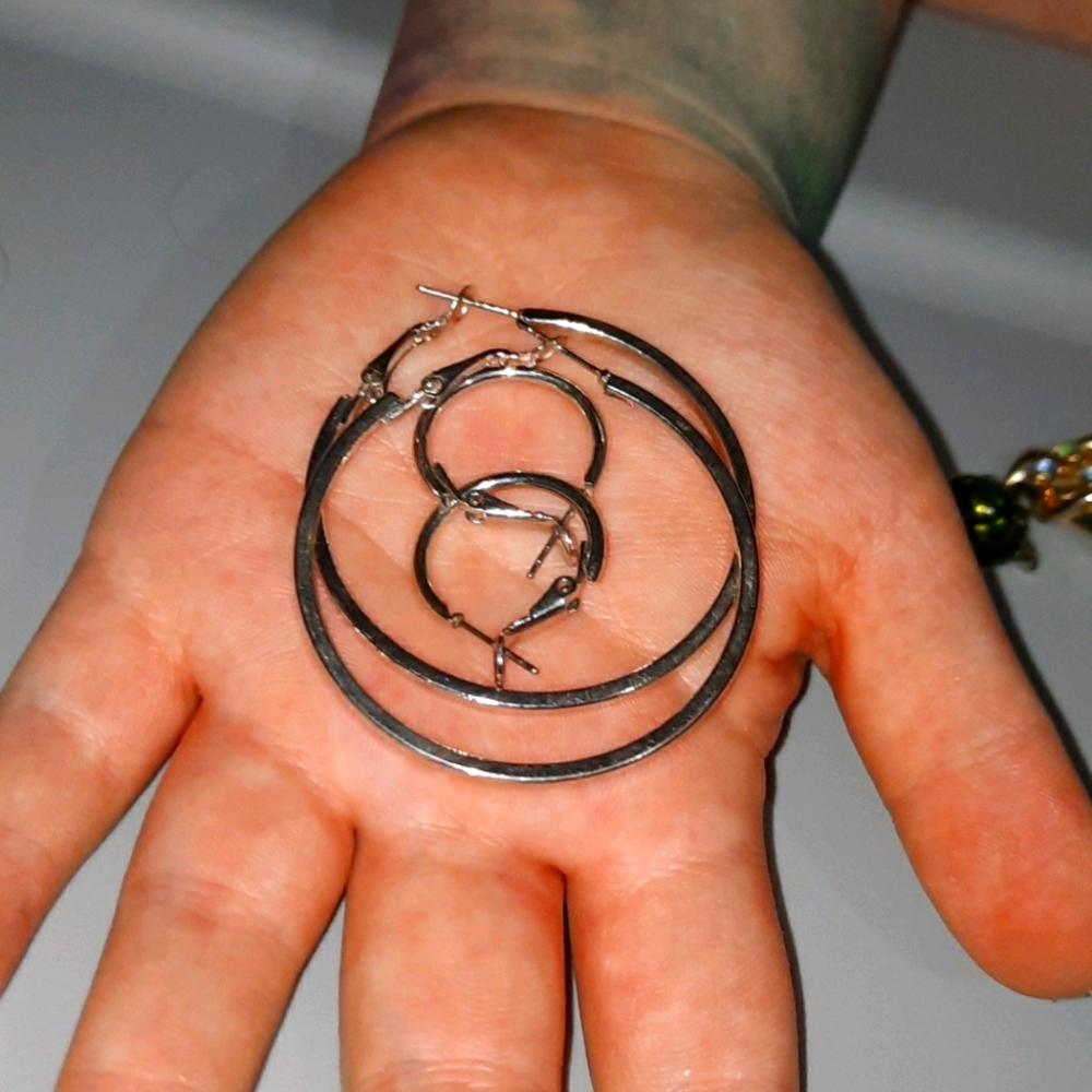 2 sets of silver earrings